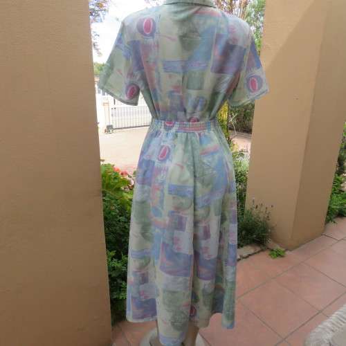 As new two piece skirt suite Short sleeve top A-line paneled skirt Size 34-10 By ` Saint Honor`