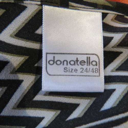 Beautiful slip-over geometric printed loose top V-neckline Size 48-24 By `Donatella` New condition