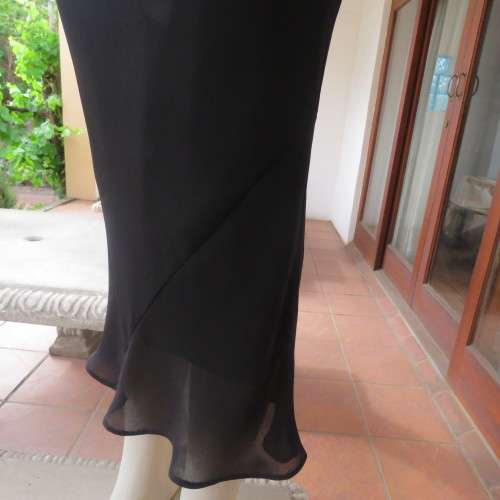 Sleek fully lined black sheer polyester maxi skirt Size 32-8 By `Massumi` New condition