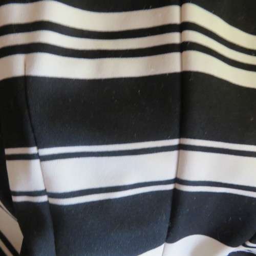 Beautiful black and cream sleeveless dress Size 34 as on doll Can fit size 36 Good condition