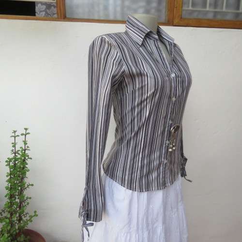 Black and white vertical striped long sleeve shirt V-neckline.and collar  Size 32/8 By Insync`As new