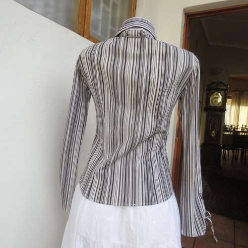 Black and white vertical striped long sleeve shirt V-neckline.and collar  Size 32/8 By Insync`As new