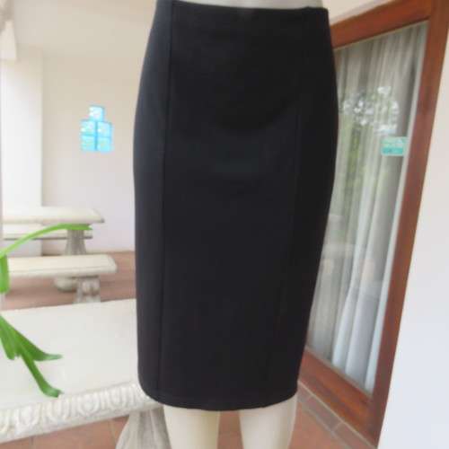 Black bodycon stretch polyester low-calf length skirt. Size 42/18. By `Donatella`. New condition.