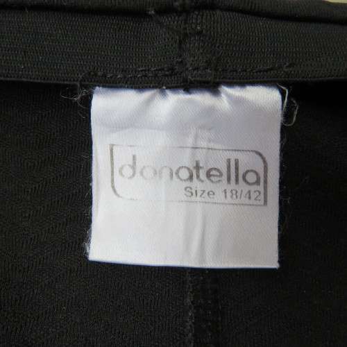 Black bodycon stretch polyester low-calf length skirt. Size 42/18. By `Donatella`. New condition.