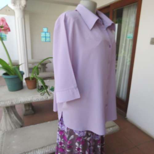 Smart lavender colour button down top with open colla. By `Smat`. In size 48/24. New condition.