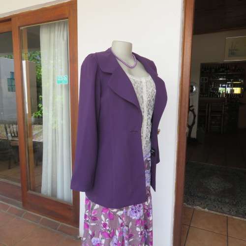 Elegant dark purple long sleeve jacket. Fully lined. By `Truworths`. In size 32/8. New condition.