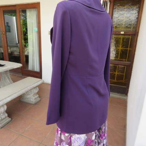 Elegant dark purple long sleeve jacket. Fully lined. By `Truworths`. In size 32/8. New condition.