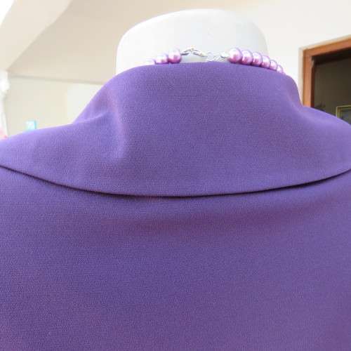 Elegant dark purple long sleeve jacket. Fully lined. By `Truworths`. In size 32/8. New condition.