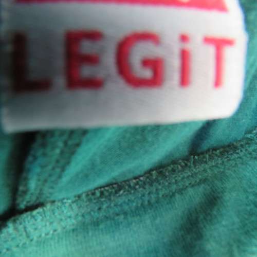 Emerald green sexy high low polycotton skirt. By LEGIT. Size 30 to 32. Elasticated waist.As new