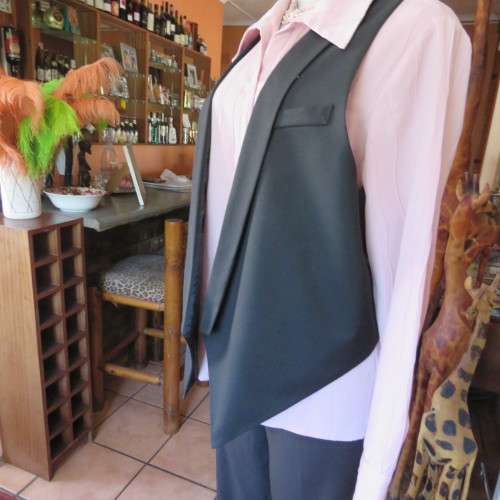 Ladies black tuxedo waistcoat. Tiny dummy front pocket. By `Legit`. In size 40/16. New condition.