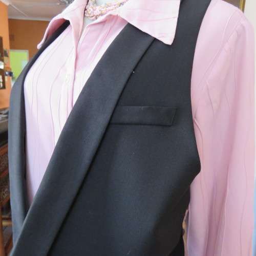 Ladies black tuxedo waistcoat. Tiny dummy front pocket. By `Legit`. In size 40/16. New condition.