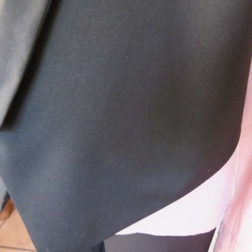 Ladies black tuxedo waistcoat. Tiny dummy front pocket. By `Legit`. In size 40/16. New condition.