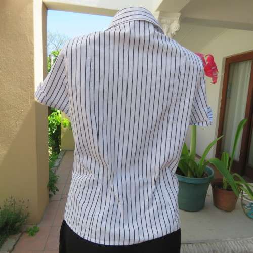 Black and white vertical striped top. Button down front. By `Insync Formal`. Size 38/14. As new.