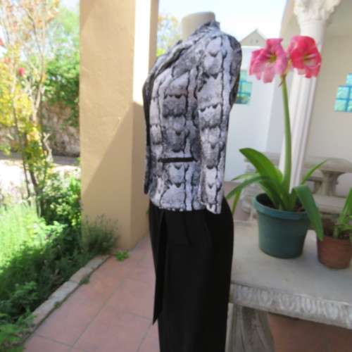 Chic black and white animal print long sleeve jacket. Open collar. Size 30/6. By `Massumi`. As new.