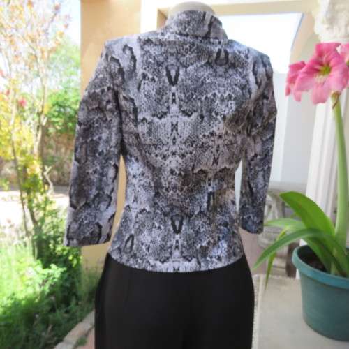 Chic black and white animal print long sleeve jacket. Open collar. Size 30/6. By `Massumi`. As new.