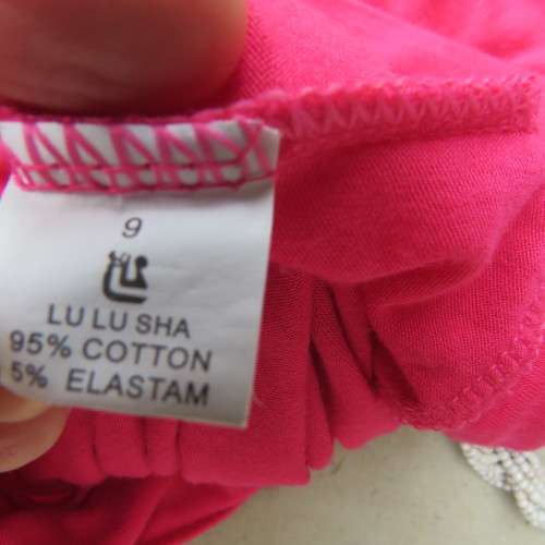 Sexy long magenta pink sleeveless top. Size 38/14. In stretch cotton. Low flowing neckline.