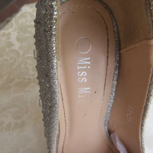 Pair as new silver pumps in size 2 with high heels. By `Miss Milano`. Used once. Still in box.