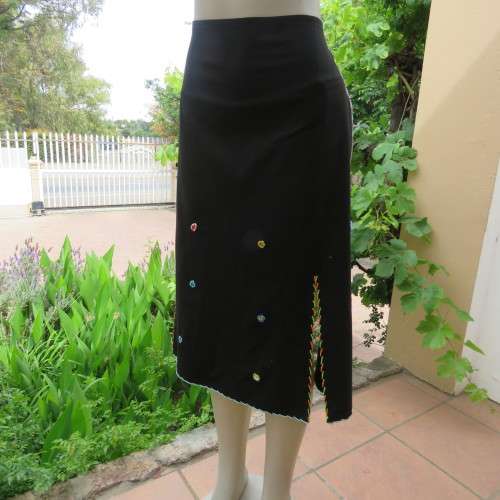 Ethnic style black apron. Bands to tie at back. With bead decoration edging. New condition.