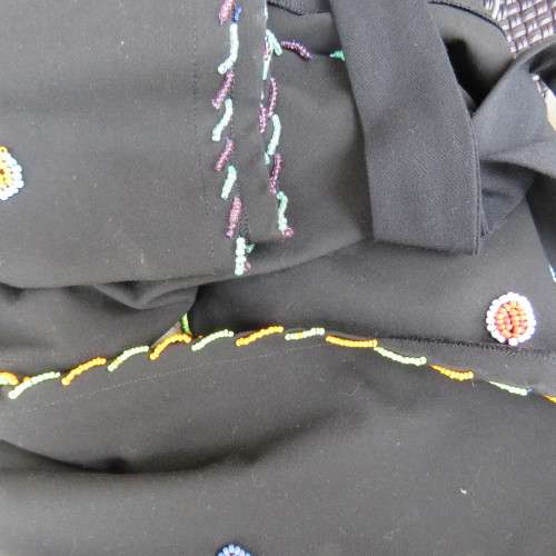 Ethnic style black apron. Bands to tie at back. With bead decoration edging. New condition.
