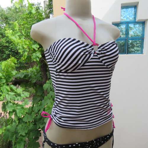 Black and white striped bathing suite top in size 30/6 by `OBR`. Build in bra. New condition.