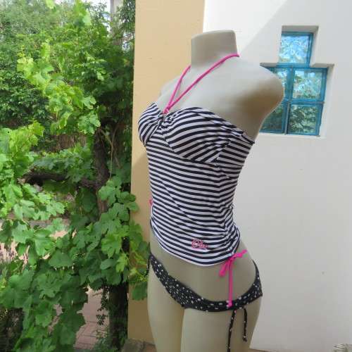 Black and white striped bathing suite top in size 30/6 by `OBR`. Build in bra. New condition.