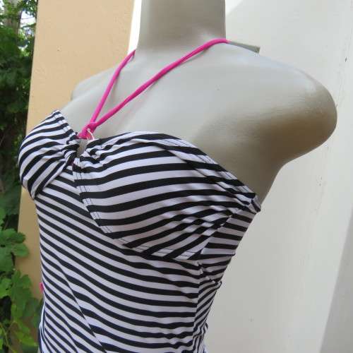 Black and white striped bathing suite top in size 30/6 by `OBR`. Build in bra. New condition.