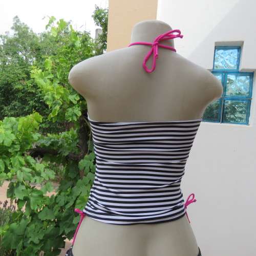 Black and white striped bathing suite top in size 30/6 by `OBR`. Build in bra. New condition.