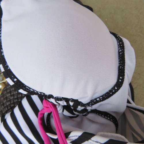 Black and white striped bathing suite top in size 30/6 by `OBR`. Build in bra. New condition.