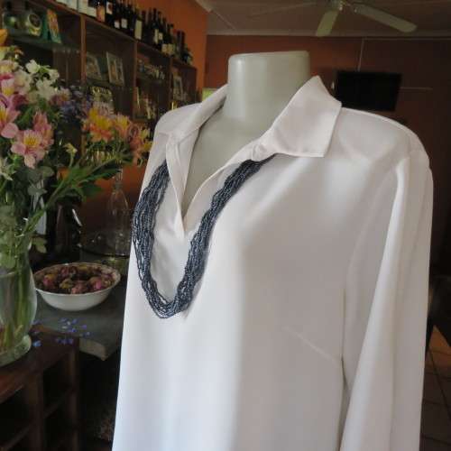 Comfy but smart white slip-over maternity top by `du date` in size 42/18. As new. Slitted sides.