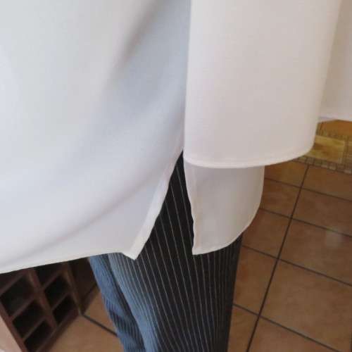 Comfy but smart white slip-over maternity top by `du date` in size 42/18. As new. Slitted sides.