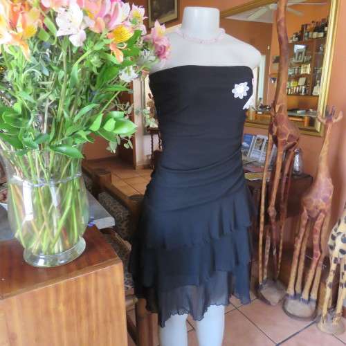Little black dress with frilled bottom and ruched strapless top. Size 34/10 By `Jin Taiyang`. As new