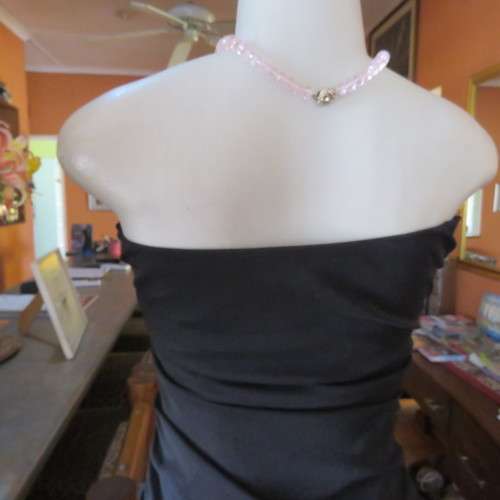 Little black dress with frilled bottom and ruched strapless top. Size 34/10 By `Jin Taiyang`. As new