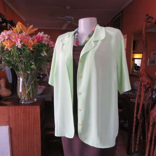 FASHION BUG  lime green soft and silky button down top. Rounded fronts Size 42-44