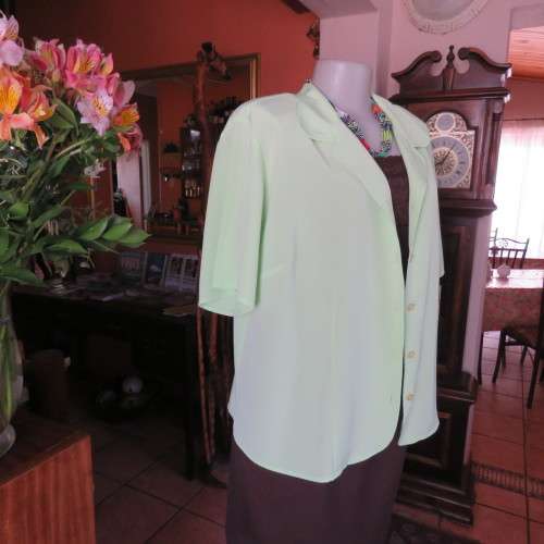 FASHION BUG  lime green soft and silky button down top. Rounded fronts Size 42-44