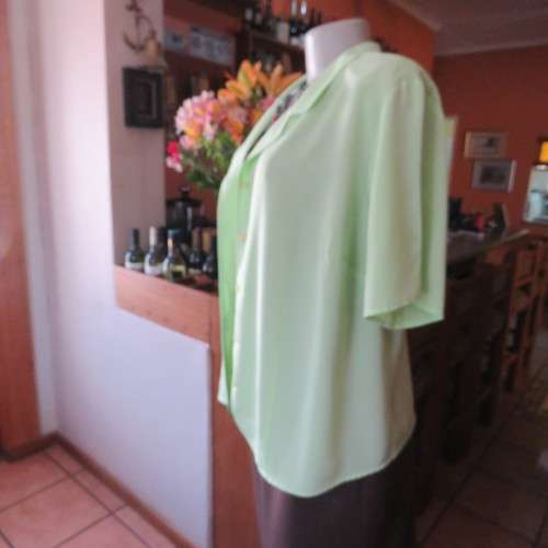 FASHION BUG  lime green soft and silky button down top. Rounded fronts Size 42-44
