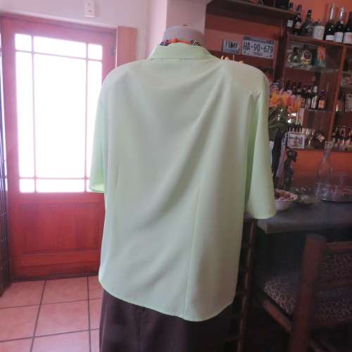 FASHION BUG  lime green soft and silky button down top. Rounded fronts Size 42-44
