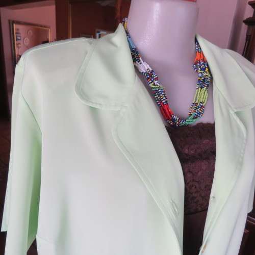 FASHION BUG  lime green soft and silky button down top. Rounded fronts Size 42-44