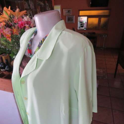 FASHION BUG  lime green soft and silky button down top. Rounded fronts Size 42-44