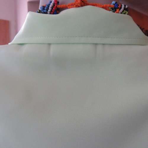 FASHION BUG  lime green soft and silky button down top. Rounded fronts Size 42-44