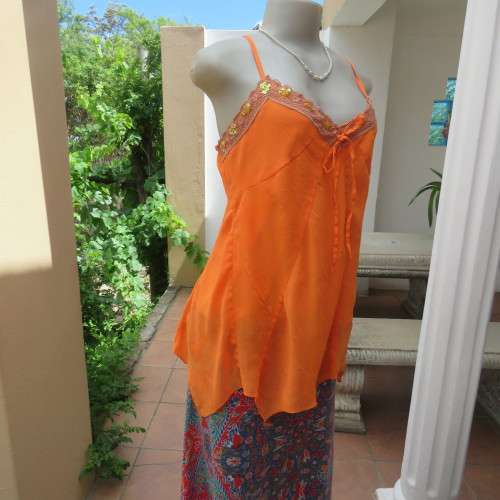 Lovely bright orange top. Thin adjustable straps. Pointed hemline. Size 36/12 by ` Shenga`. As new.