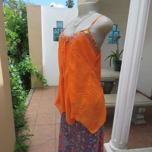 Lovely bright orange top. Thin adjustable straps. Pointed hemline. Size 36/12 by ` Shenga`. As new.