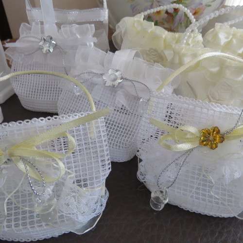 We have ten white and three cream decorated bags suitable for wedding cake or confetti. About 9x7cm.