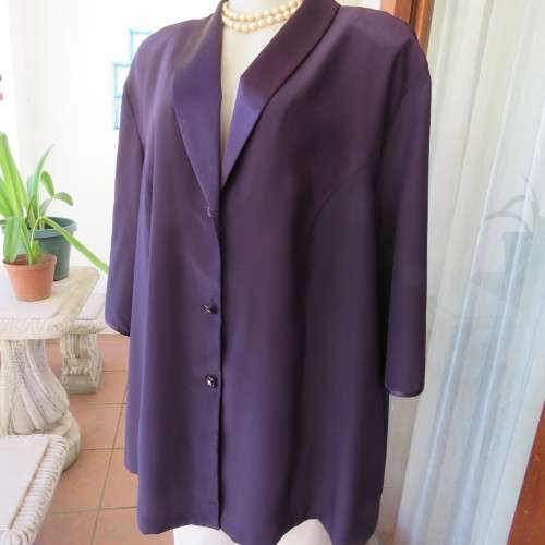 Top of the line very dark purple short sleeve top/jacket by `Penny C` in size 52/28. New condition.