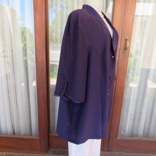 Top of the line very dark purple short sleeve top/jacket by `Penny C` in size 52/28. New condition.