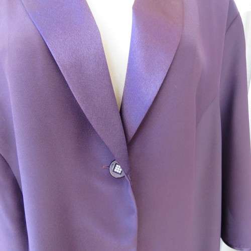 Top of the line very dark purple short sleeve top/jacket by `Penny C` in size 52/28. New condition.