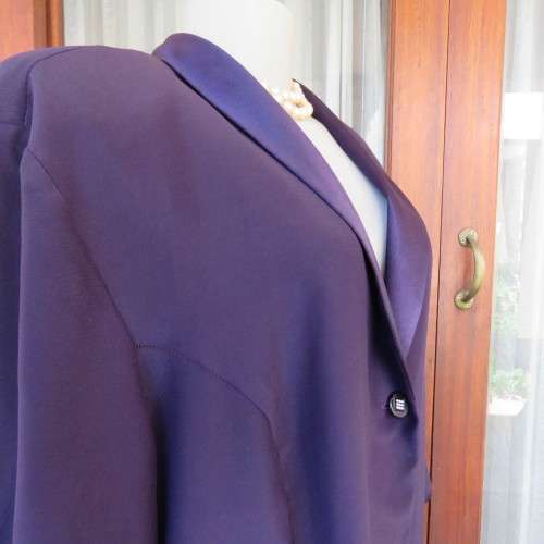 Top of the line very dark purple short sleeve top/jacket by `Penny C` in size 52/28. New condition.