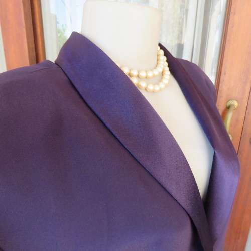 Top of the line very dark purple short sleeve top/jacket by `Penny C` in size 52/28. New condition.