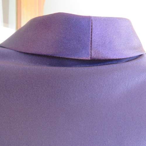 Top of the line very dark purple short sleeve top/jacket by `Penny C` in size 52/28. New condition.