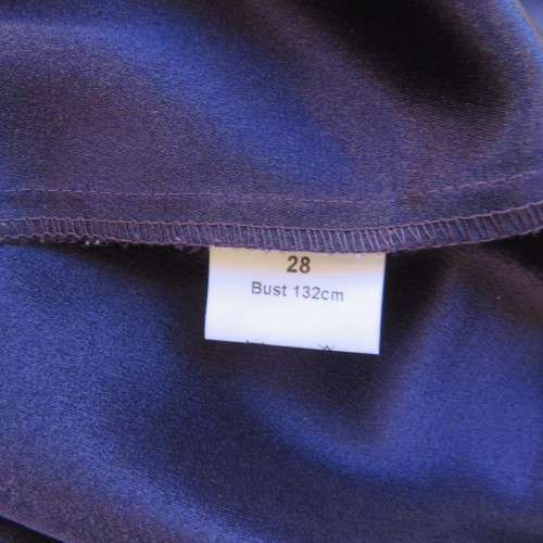 Top of the line very dark purple short sleeve top/jacket by `Penny C` in size 52/28. New condition.