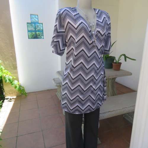 Stunning cross-over long white, black and grey top. By `Donna-Claire`. Size 44/20. New condition.